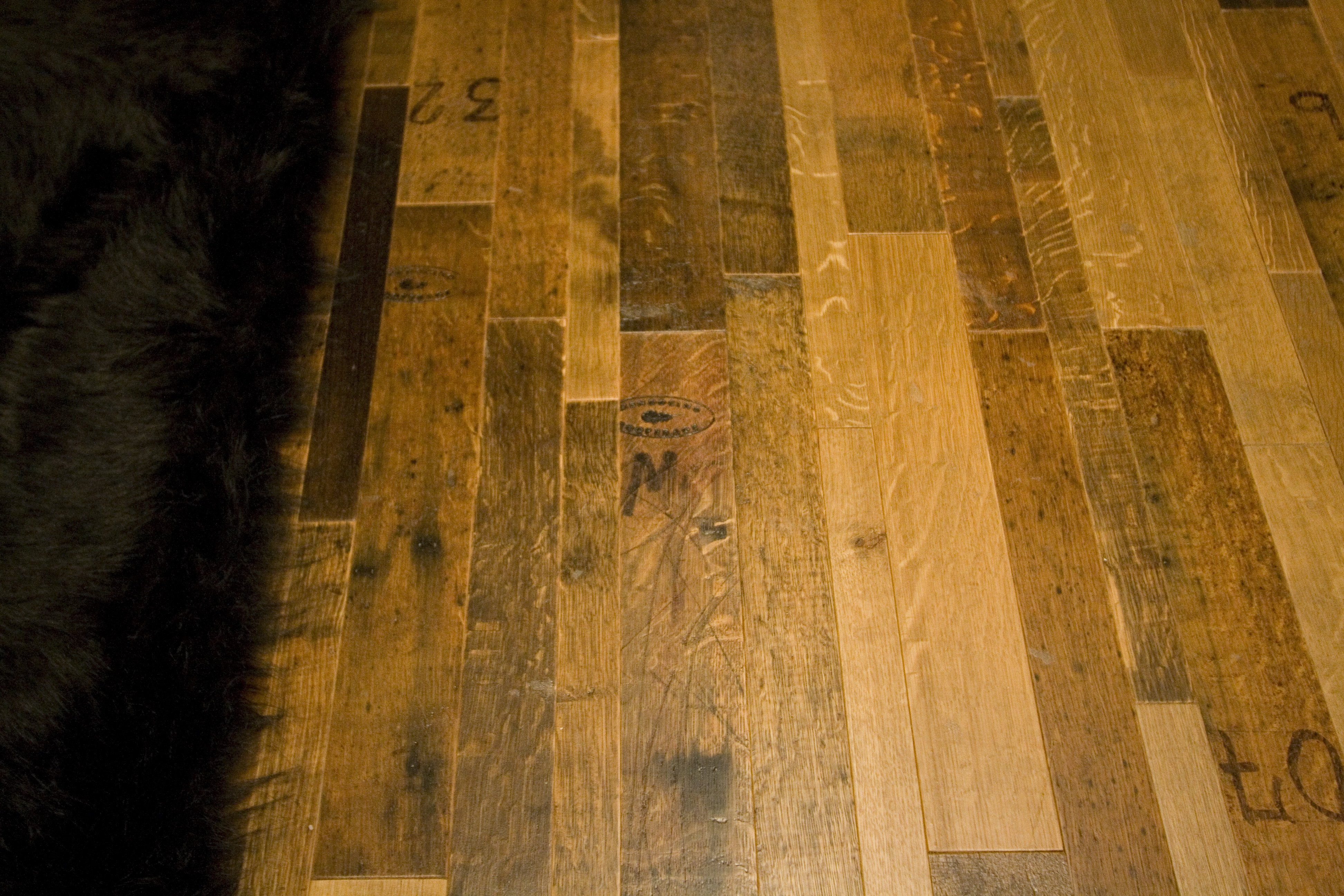 Reclaimed oak wine barrel flooring is one of the most popular choices. Not only is the material beautiful, it is also eco-friendly. 