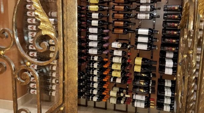 How Master Builders Transformed a Boring Room Into a Contemporary Home Wine Cellar in Irvine Using Floor to Ceiling Metal Wine Racks