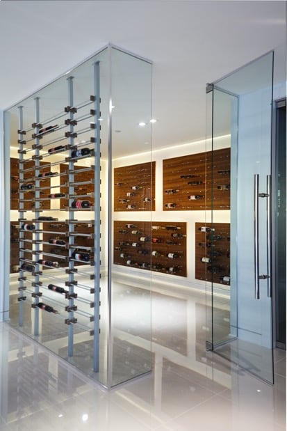 Contemporary Wine Cellar with Glass Walls and Metal Wine Racks Los Angeles