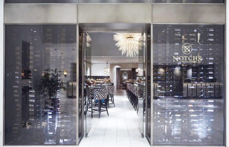 This Glass-Enclosed Refrigerated Commercial Wine Cellar with Contemporary Wine Racks is a Perfect Addition to the High-End Hotel 