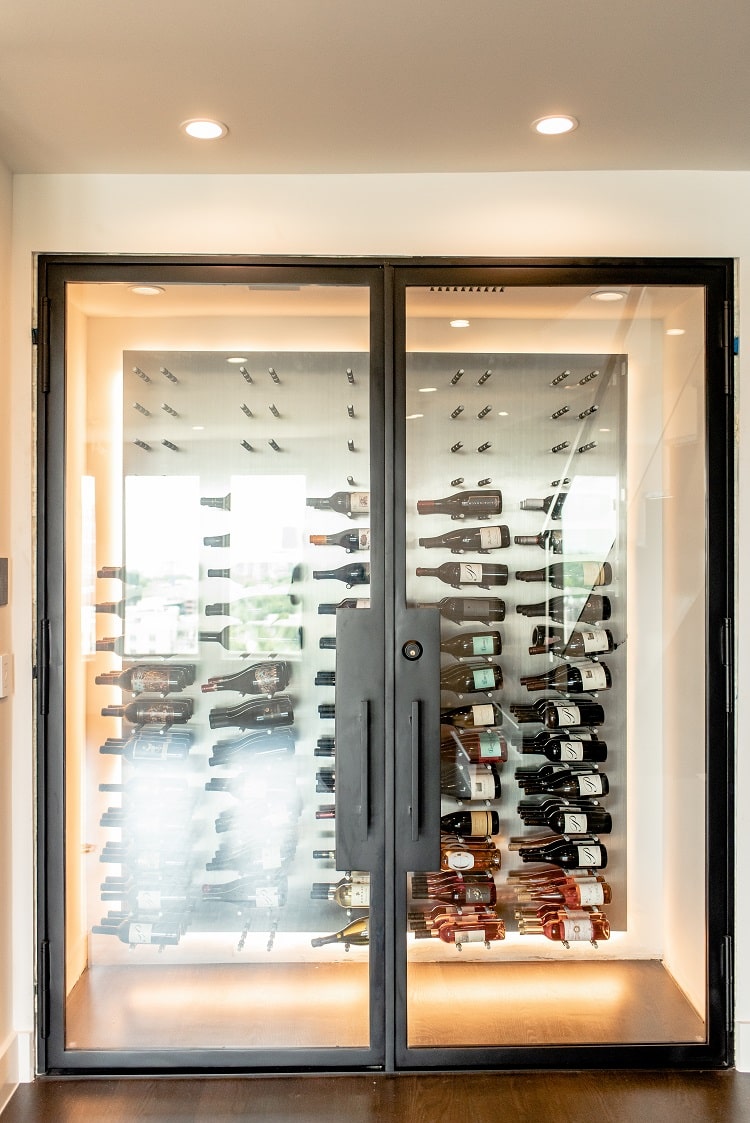 Small glass wine cellars aren't only for under the stair spaces. Check this glass wine cellar we built in resdiential hallway in California.