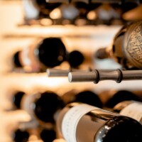 Our metal rods are customized with dents and rubber O-rings to keep the bottles in place.