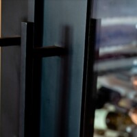 We painted our glass door handles with matte black for a modern, no-fail look.