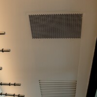 This a ceiling-mounted wine cellar cooling unit which won't take up space inside your small, wine closet under your apartment stairs.