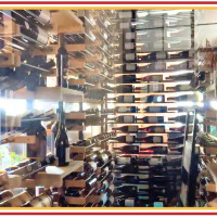 (7) Showcasing fine vintages with the elegance of crystal-clear glass and impeccable lighting.