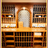 (3) A central arch can elevate the look of any large traditional wine cellar shelf.