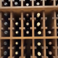 (9) Organizing bottles neatly like this is made possible with thoughtfully-designed commercial wine room racks.