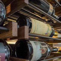 (6) Metal on wood is a very classic wine closet idea that gives the entire display a timeless look.