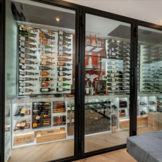(1) Whether open or close, these framed glass wine cellar doors for homes allow the perfect view of the collection.