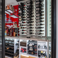 (4) This home's wine cellar cooling system is tucked neatly into the ceiling grid, engineered to keep the environment consistent without disrupting the aesthetic.